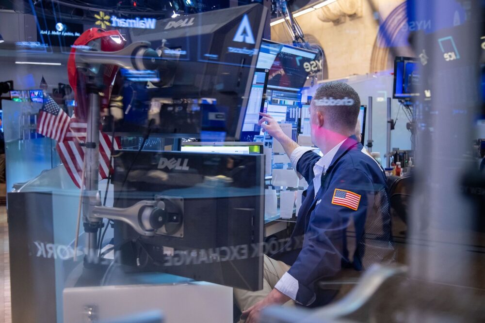 Traders On The Floor Of The New York Stock Exchange As US Stocks Trade Steady as Traders Assess Earnings, Tariff Risk Traders On The Floor Of The New York Stock Exchange As US Stocks Trade Steady as Traders Assess Earnings, Tariff Risk